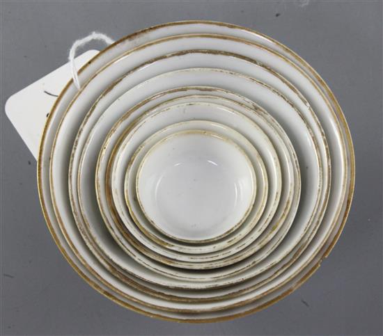 A set of nine Chinese famille rose nesting cups, Daoguang period, graduating from 4.1cm to 11cm, largest cup with rim chip and short ha